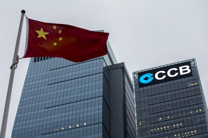A Chinese national flag flies in front of the China Construction Bank (CCB) Tower at Hong Kong's business Central district in this December 26, 2014 file photo. u00e2u20acu201d Reuters pic