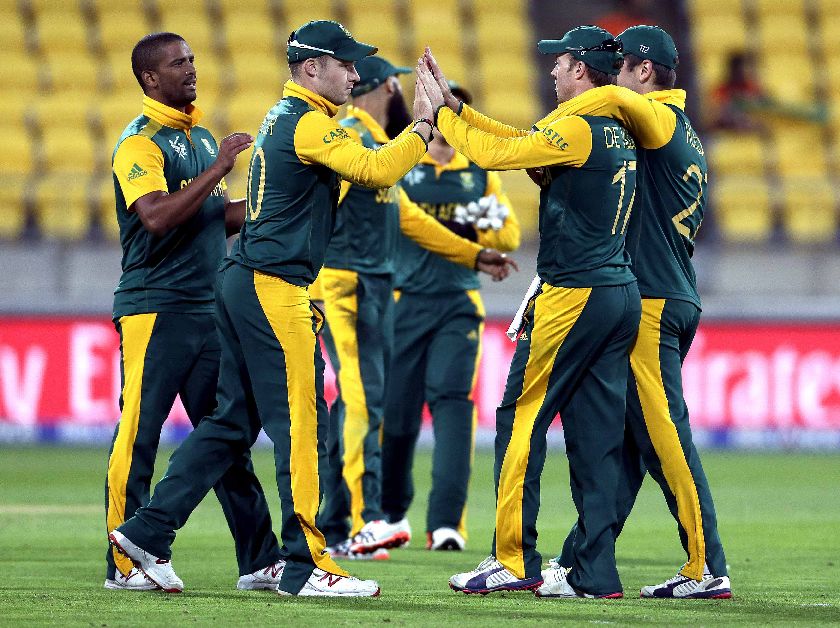 South Africau00e2u20acu2122s Rilee Rossouw (R) and captain AB de Villiers celebrate the dismissal of United Arab Emiratesu00e2u20acu2122 Mohammad Naveed Cricket World Cup match in Wellington, March 12, 2015. REUTERS/Anthony Phelps