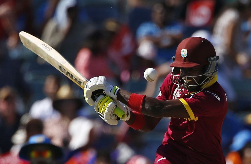 West Indies batsman Jonathan Carter swings at the ball during his Cricket World Cup match against India in Perth, March 6, 2015. REUTERS/David Gray 