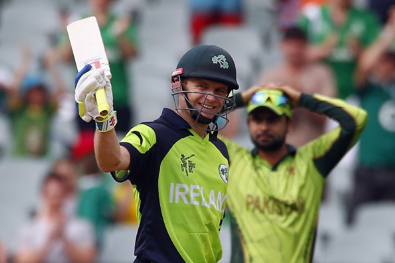 Irelandu00e2u20acu2122s William Porterfield (L) celebrates reaching his century as Pakistanu00e2u20acu2122s Ahmed Shahzad rues the implication in their Cricket World Cup match at the Adelaide Oval March 15, 2015. REUTERS/David Gray