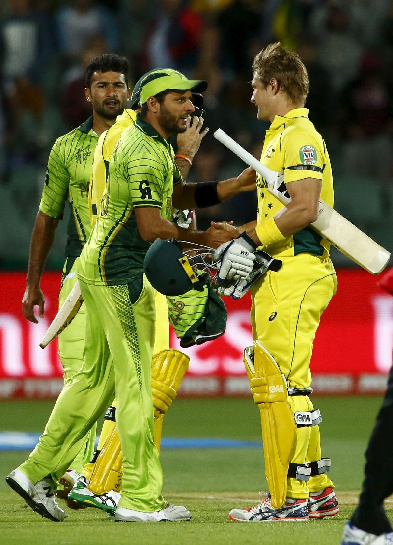 Shane Watson (right) shakes hands with Shahid Afridi, who bows out of one-day internationals at this World Cup.