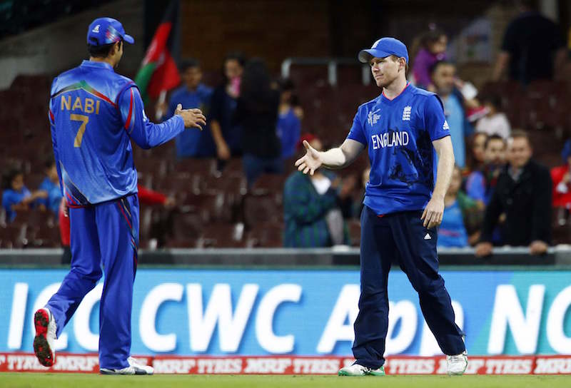 Englandu00e2u20acu2122s captain Eoin Morgan (right) walks to shake hands with Afghanistanu00e2u20acu2122s captain Mohammad Nabi after winning their Cricket World Cup match at the Sydney Cricket Ground (SCG) March 13, 2015. u00e2u20acu201d Reuters pic