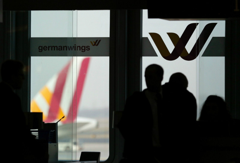 Passengers are silhouetted against a window at the Germanwings check-in desk at Dusseldorf airport March 24, 2015.  u00e2u20acu201d Reuters pic