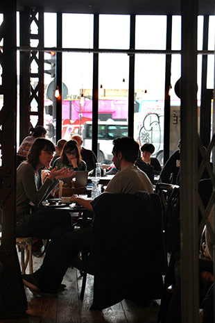 Hunky-dory Hipsters chilling without any cares at Café Lomi in Paris.