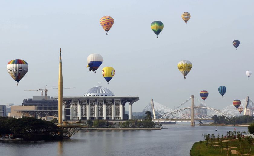 Balloons fly over the Tuanku Mizan Zainal Abidin mosque during the Hot Air Balloon festival in Putrajaya March 12, 2015. u00e2u20acu201d Reuters pic