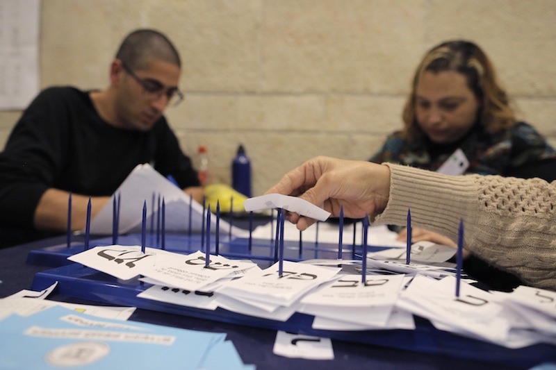 Israeli workers count ballots cast by Israeli soldiers and civil servants living overseas at the central elections committee building in the Knesset, the Israeli parliament, in Jerusalem March 18, 2015.u00c2u00a0u00e2u20acu201d Reuters pic