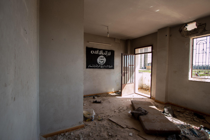 An Islamic State flag hangs on the wall of an abandoned building in Tel Hamis in Hasaka countryside after the Kurdish People's Protection Units (YPG) took control of the area March 1, 2015. u00e2u20acu201d Reuters pic