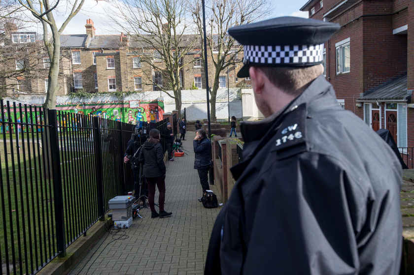 A police officer on duty outside a London house on February 27, 2015, where Kuwaiti-born Mohammed Emwazi,  identified by experts and media as'Jihadi John,' is once believed to have lived. u00e2u20acu201d AFP pic