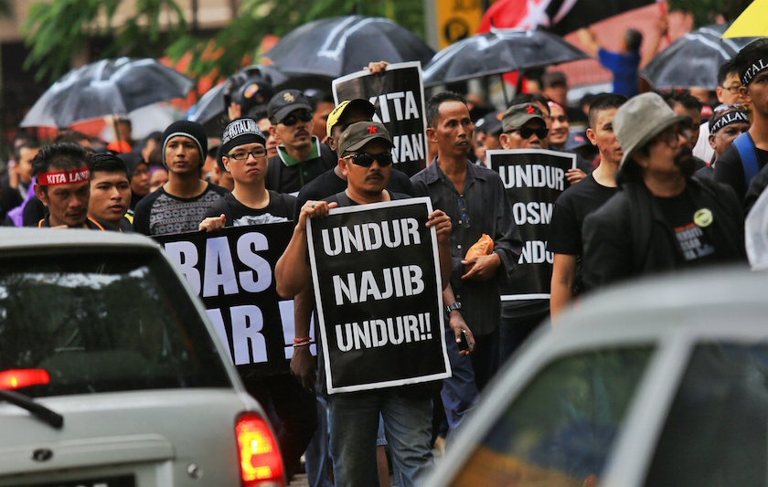 Demonstrators hold banners during the #KitaLawan rally in Kuala Lumpur March 7, 2015. u00e2u20acu201d Picture by Saw Siow Feng