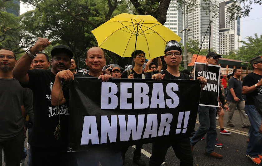 Demonstrators hold banners during the #KitaLawan rally in Kuala Lumpur March 7, 2015. u00e2u20acu201d Picture by Saw Siow Feng