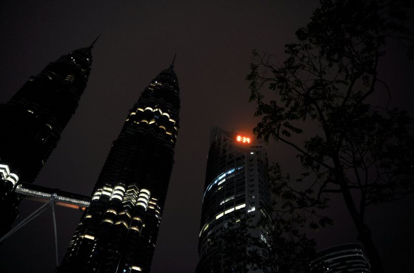 The Petronas Twin Towers are pictured with most of their lights switched off during Earth Hour yesterday. u00e2u20acu201d Bernama pic