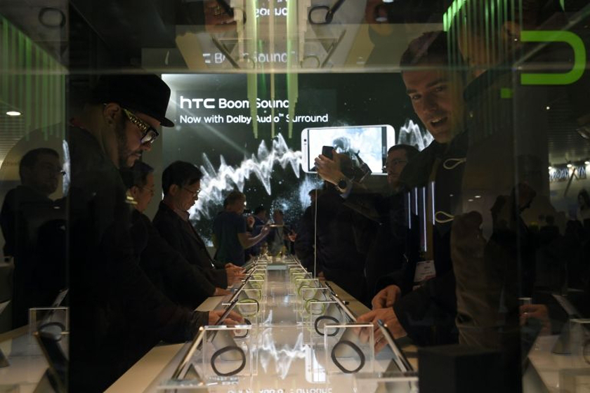Visitors test phones during the 2015 Mobile World Congress (MWC) in Barcelona on March 4, 2015. u00e2u20acu201d AFP pic