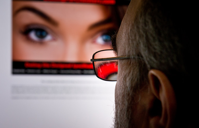 A man looks at a dating site on his computer in Washington,DC on February 10, 2014. u00e2u20acu201d AFP pic