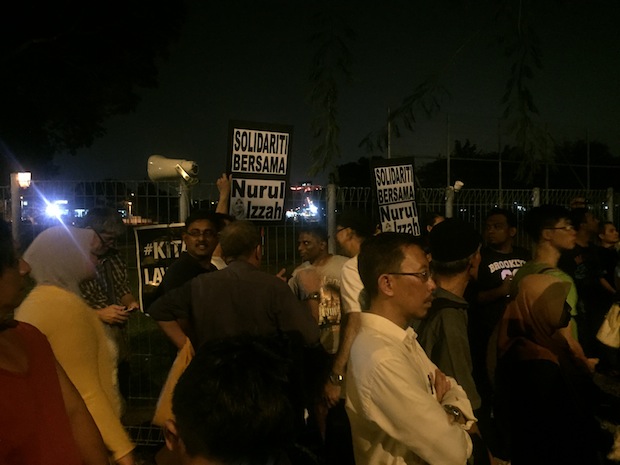 Hunderds of supporters gather outside Jinjang lockup for a candlelight vigil in support of PKR vice president Nurul Izzah Anwar, March 16, 2015.