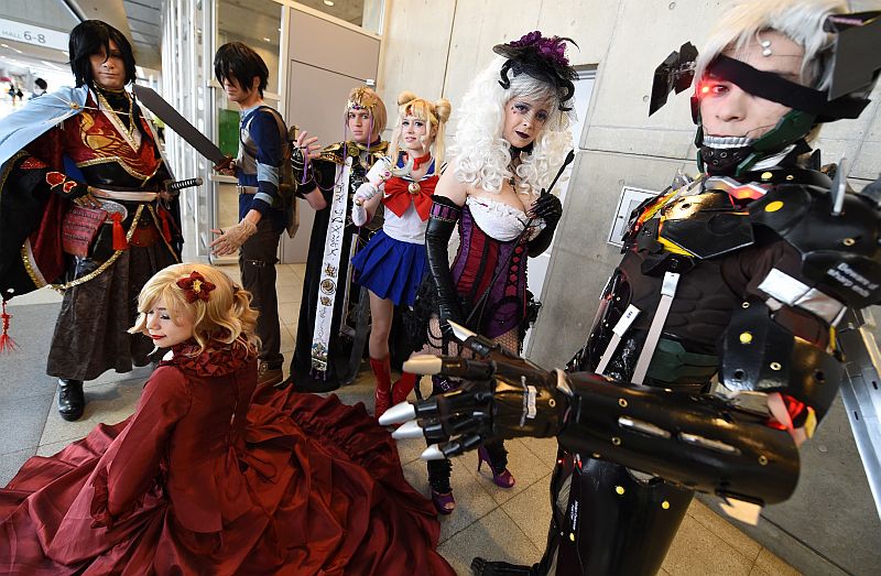 People dressed as their favourite anime characters pose for photographers during the Otaku Summit in Chiba, suburb of Tokyo, on March 28, 2015.  u00e2u20acu2022 AFP pic