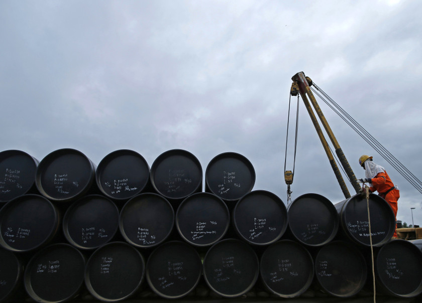 A worker prepares to transport oil pipelines to be laid for the Pengerang Gas Pipeline Project at an area 40km away from the Pengerang Integrated Petroleum Complex in Pengerang, Johor, February 4, 2015. u00e2u20acu201d Reuters pic