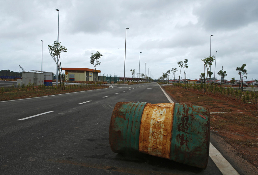 A rusty oil barrel lies in the middle of a road in the largely empty new township built for workers of the Pengerang Integrated Petroleum Complex in Pengerang, in the southeastern tip of Johor, February 4, 2015. u00e2u20acu201d Reuters pic