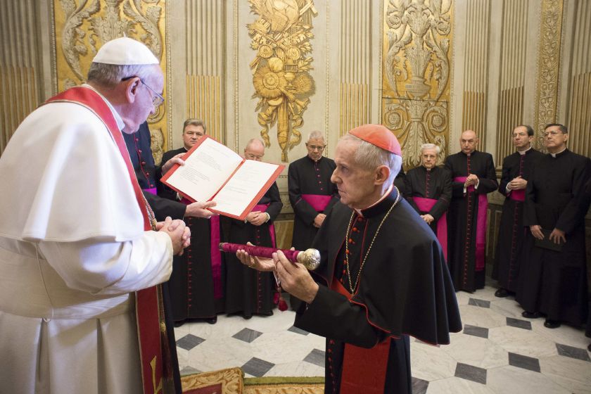 Pope Francis reads a speech during French Cardinal Jean-Louis Tauran's (right) oath ceremony for the office of camerlengo, at the Vatican March 10, 2015. u00e2u20acu2022 Reuters pic