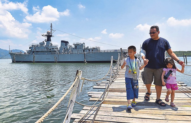 Jason Ang, 40 , and his children Ethan, nine, and Elli, five, visit the Rahmat Maritime Museum, which is a decomissioned RMN vessel in Lumut.
