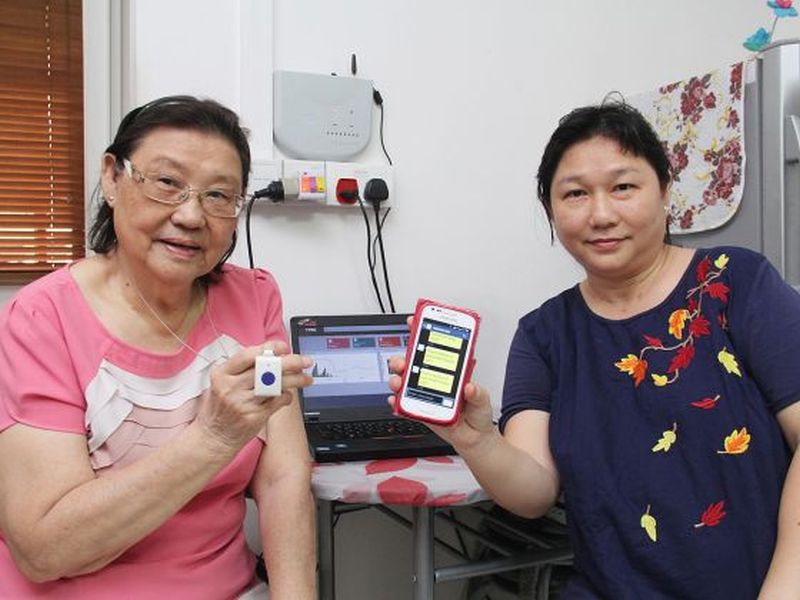 Pre-school teacher Doris Oo (right) and her mother Mabel Chen (left) with the SEMAS system. u00e2u20acu2022 Today pic
