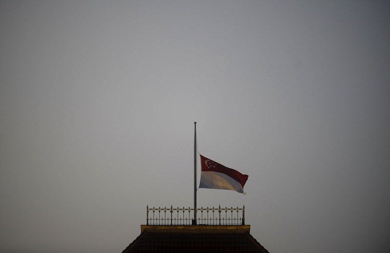 The state flag is pictured at half-mast at the Parliament building in Singapore March 23, 2015. Lee Kuan Yew died aged 91.u00c2u00a0u00e2u20acu201d Reuters pic