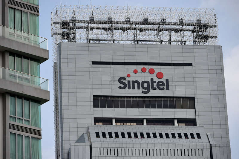 An exterior view shows the new logo of Singapore Telecom displayed on its building in Singapore on January 22, 2015. u00e2u20acu201d AFP pic