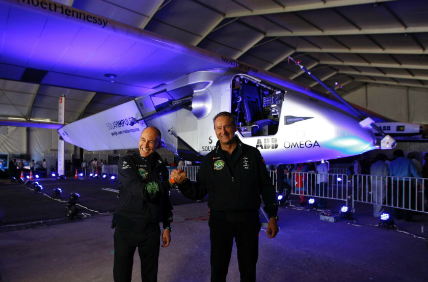 Swiss pilots Bertrand Piccard and Andre Boschberg (right) pose in front of the u00e2u20acu02dcSolar Impulse 2u00e2u20acu2122, a solar powered plane, at the airport in the western Indian city of Ahmedabad March 11, 2015. u00e2u20acu201d Reuters pic
