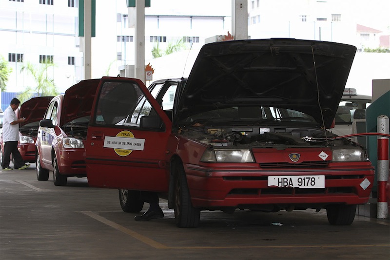 Taxi drivers gathering at a Petronas station to express support to the SPAD regarding increasing hike in public transportation fares that was announced in Kuala Lumpur, March 22, 2015. u00e2u20acu201d Picture by Yusof Mat Isa 