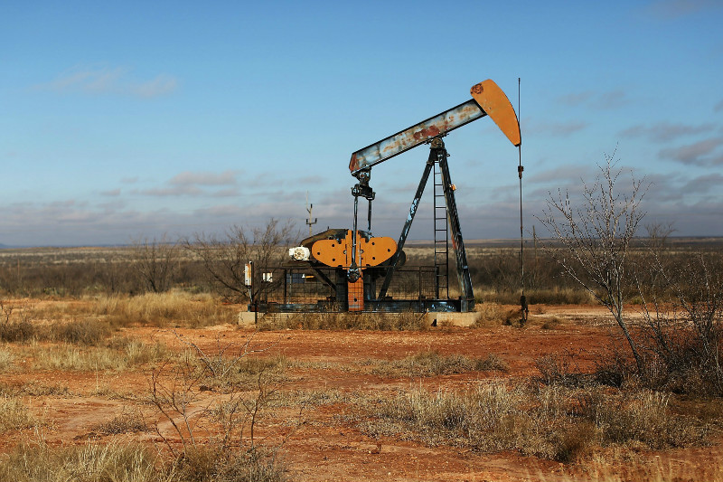 An oil pump is viewed on February 4, 2015 in Big Springs, Texas. Crude oil prices have fallen nearly 60 per cent globally. u00e2u20acu201d AFP pic