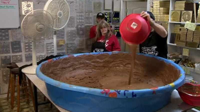 This Reuters video screenshot shows the Candy Factory staff in the midst of an attempt to make the largest peanut butter cup in the world.