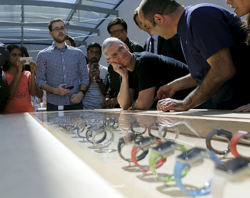 Apple CEO Tim Cook looks over a selection of Apple Watches in Palo Alto, California April 10, 2015. u00e2u20acu201d Reuters pic