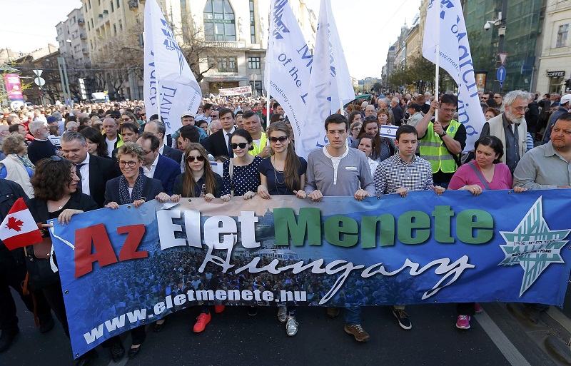 People participate in the annual ‘March of the Living’ to commemorate the deaths of around half a million Hungarian Jews during the Holocaust in World War Two, in Budapest April 12, 2015. — Reuters pic 