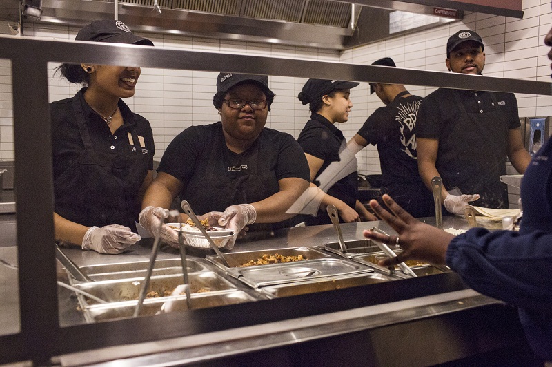 Employees prepare orders at a Chipotle restaurant in New York, April 23, 2015. u00e2u20acu201d Picture by Kirsten Luce for The New York Times