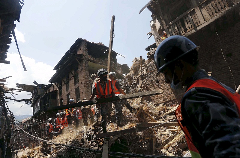 Nepalese army personnel clear the debris of a collapsed house as they carry out rescue operations following Saturdayu00e2u20acu2122s earthquake in Bhaktapur, Nepal April 27, 2015. u00e2u20acu201d Reuters pic
