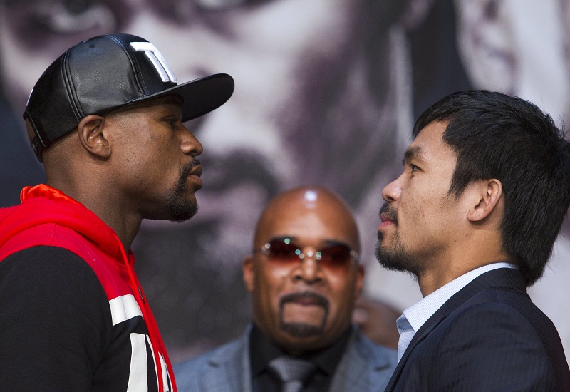 Undefeated WBC/WBA welterweight champion Floyd Mayweather Jr. (left) of the US and WBO welterweight champion Manny Pacquiao of the Philippines face off during a final news conference at the MGM Grand Arena in Las Vegas, Nevada April 29, 2015.  u00e2u20acu201d Reuters