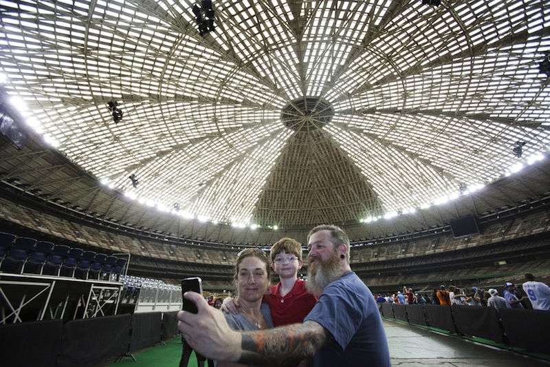 (From left) Tiffany Almquist, 38, Samuel Almquist, 7 and Adam Almquist, 39, pose for a selfie as people celebrate the 50th anniversary of the Astrodome stadium in Houston, Texas, April 9, 2015.u00c2u00a0u00e2u20acu201d Reuters pic