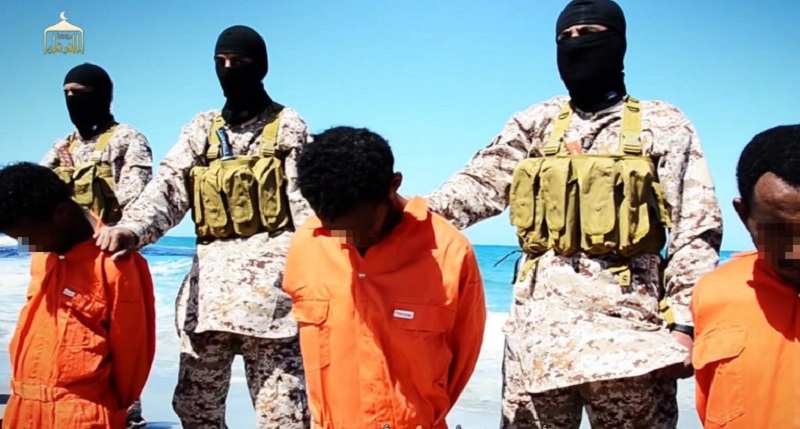 An image grab from a video reportedly released by the Islamic State shows men described as Ethiopian Christians captured in Libya kneeling on the ground in front of masked militants before their beheading on a beach in Libya, April 19, 2015. u00e2u20acu201d AFP pic