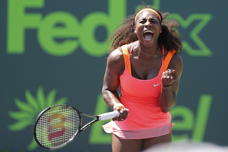 Serena Williams celebrates after winning a point against Sabine Lisicki (not pictured) on day 10 of the Miami Open at Crandon Park Tennis Centre in Florida, April 2, 2015. Williams won 7-6 (4), 1-6, 6-3. u00e2u20acu201d Reuters pic
