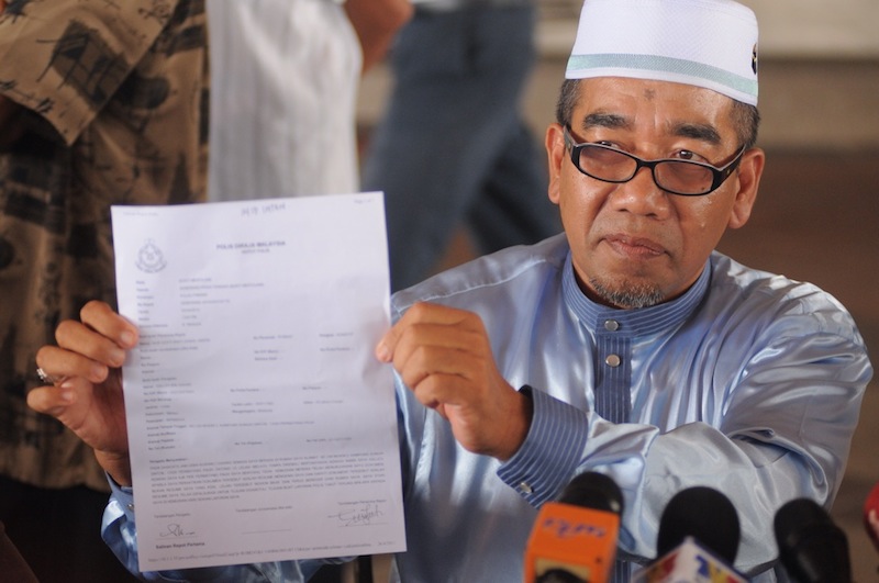 Permatang Pauh by-election independent candidate Salleh showing his police report, April 26, 2015. u00e2u20acu201du00c2u00a0Picture by K.E. Ooi