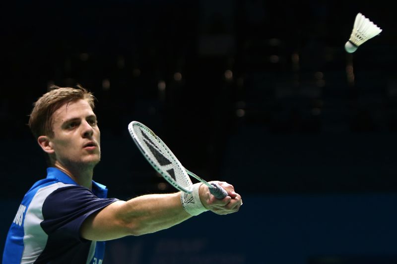Badminton player Hans-Kristian Vittinghus of Denmark plays a shot to Chen Long of China BWF Destination Dubai World Superseries Finals at Hamdan Sports Complex in Dubai December 21, 2014. AFP PHOTO / MARWAN NAAMANI
