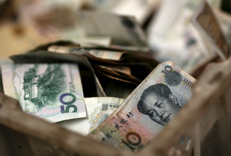 Chinese banknotes are seen in a vendoru00e2u20acu2122s cash box at a market in Beijing, in this February 14, 2014 file photograph. u00e2u20acu201d Reuters pic