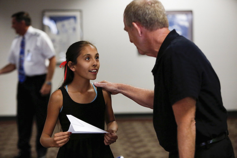 Captain Ron Nielsen talks to 10-year-old Lynzi Jessen during his ‘Fearless Flying’ class at Sky Harbour International Airport in Phoenix, Arizona April 4, 2015. — Reuters pic