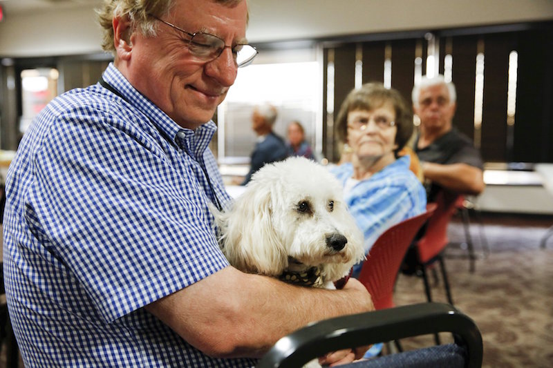Lawrence Spalla, holding his service dog Danny, attends Captain Ron Nielsen’s ‘Fearless Flying’ class at Sky Harbour International Airport in Phoenix, Arizona April 4, 2015. — Reuters pic