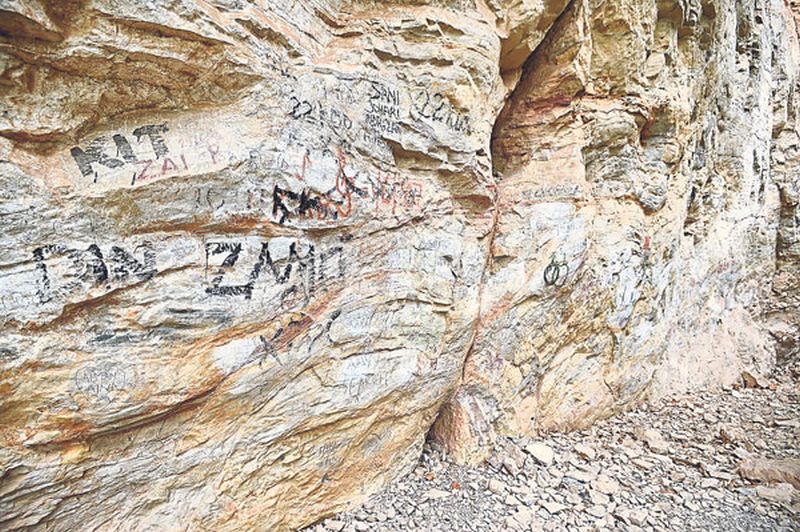 A section of the wall defaced by graffiti. u00e2u20acu201d Picture by Marcus Pheong