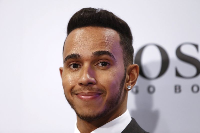 Mercedes Formula One driver Lewis Hamilton attends a Hugo Boss promotional event in Shanghai April 8, 2015, ahead of the Chinese Grand Prix. REUTERS/Aly Song