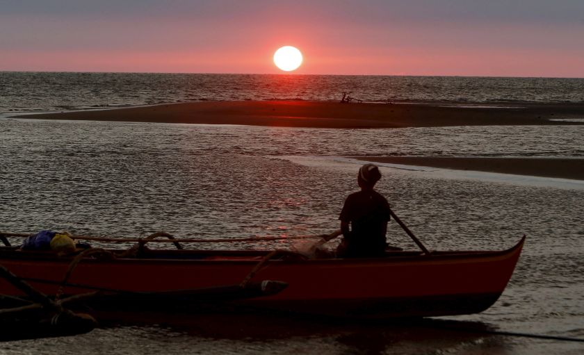 A fisherman watches sunset in the South China Sea, about 130 nautical miles from Scarborough Shoal in the coastal town of Masinloc, Zambales in northern Philippines. u00e2u20acu201d Reuters pic