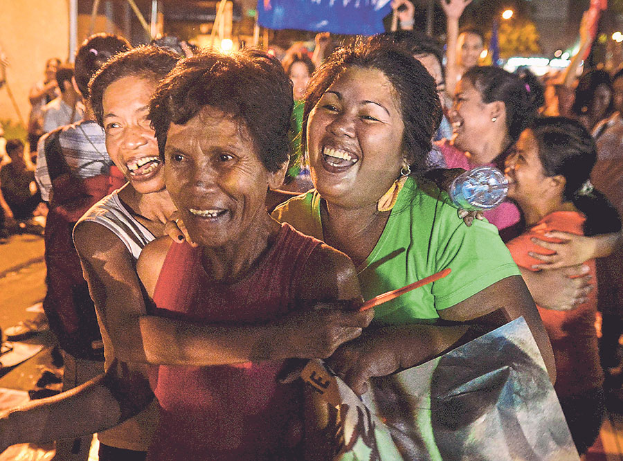 Activists react to the news of Velosou00e2u20acu2122s last-minute reprieve outside the Indonesian embassy in Makati in the Philippines yesterday morning. u00e2u20acu201d Reuters pic