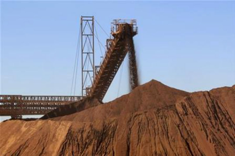File picture shows iron ore being loaded into a pile at Fortescue Metals Cloudbreak iron ore mine, about 250km southeast of Port Hedland in Western Australia. u00e2u20acu201d Reuters pic