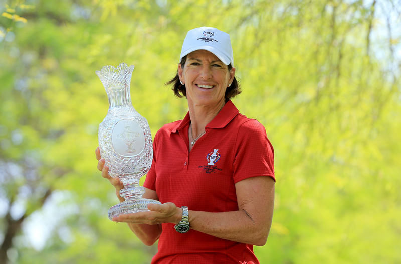 Juli Inkster, US team captain for the 2015 Solheim Cup, poses with the trophy on April 1, 2015 in Rancho Mirage, California. u00e2u20acu201d AFP pic