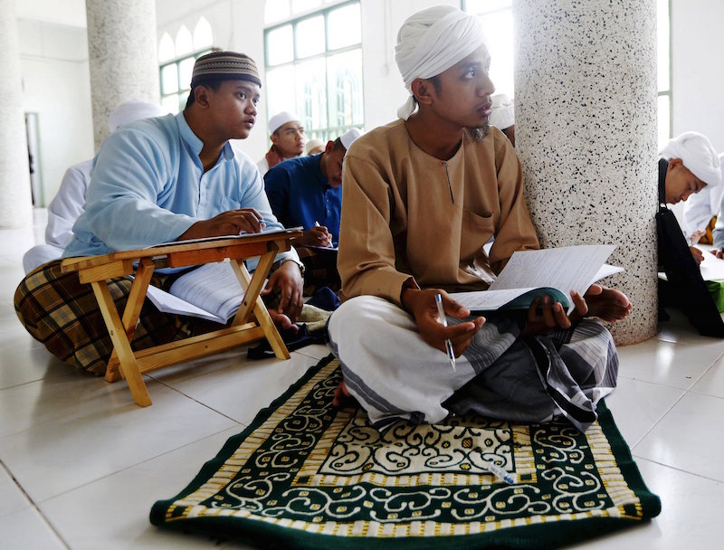 Islamic students take a class at Madrasah Ad-Diniyyah Al-Bakhriyyah in Kota Baru April 5, 2015. u00e2u20acu201d Reuters pic